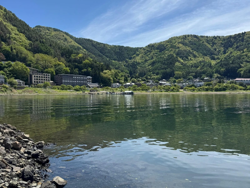 Lake Kawaguchiko with green mountains and calm water